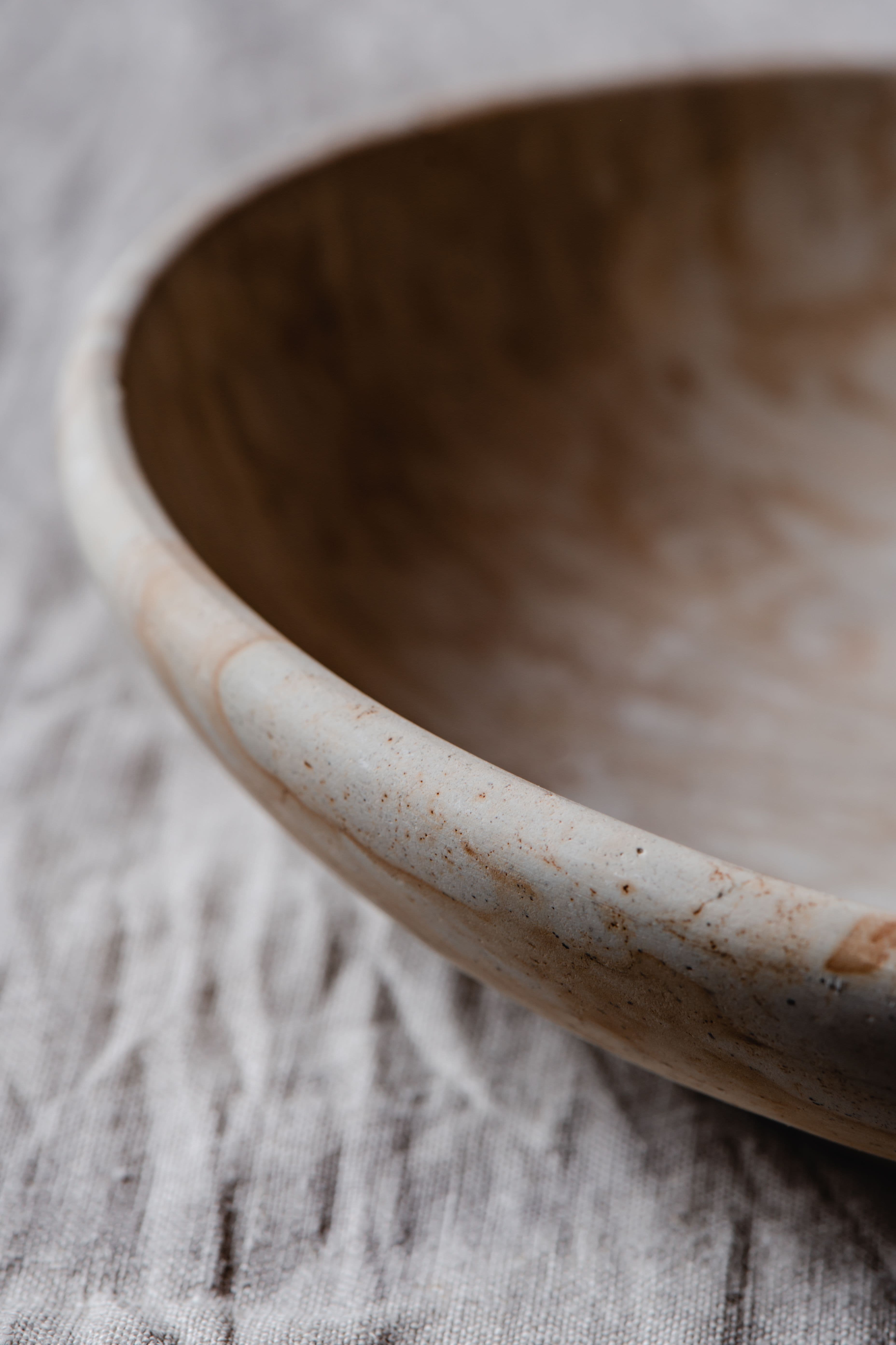 Close detail of the glaze and foot on a stoneware bowl