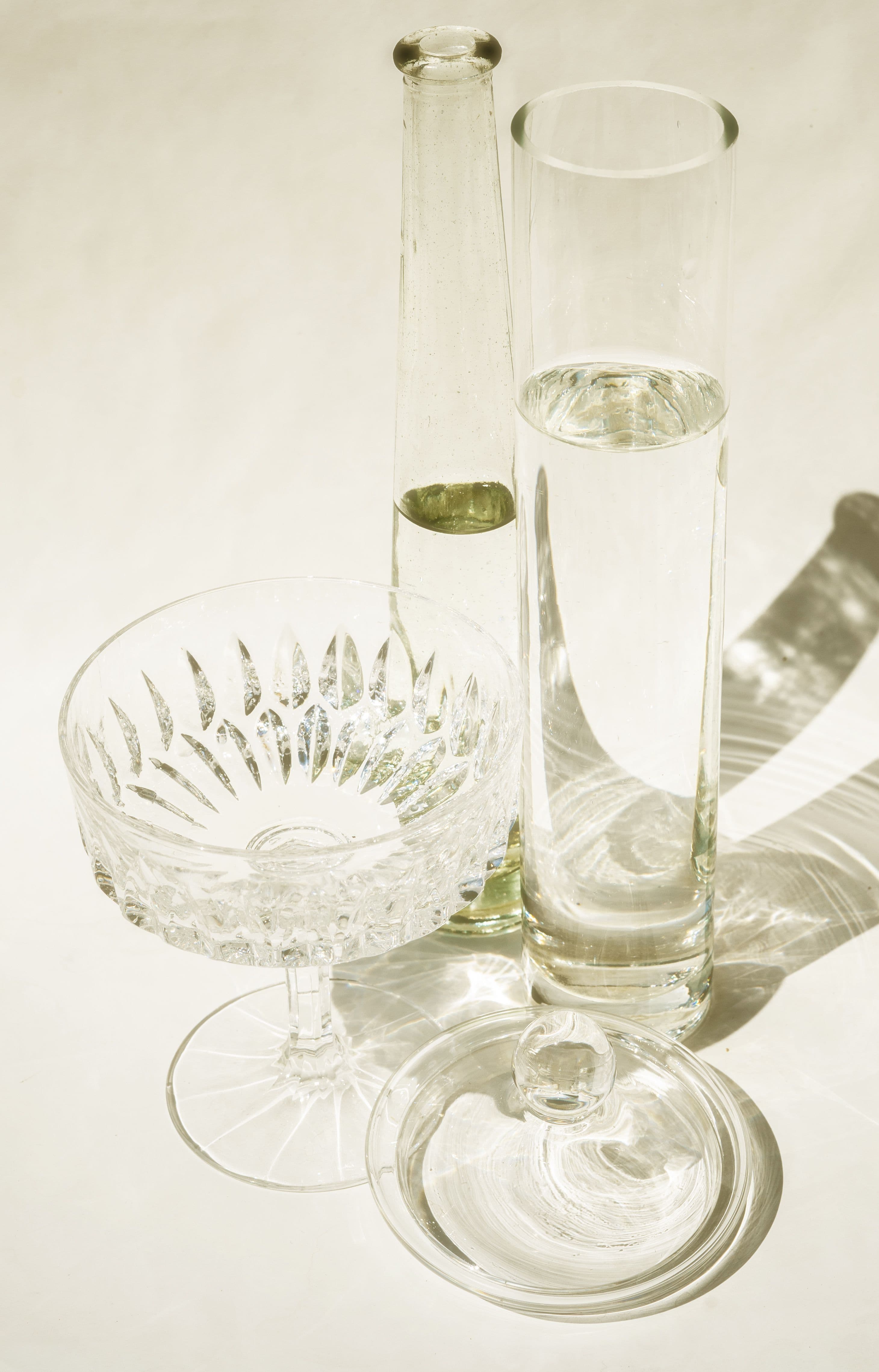 A small, mismatched set of vintage crystal glasses, gathered rather than matched