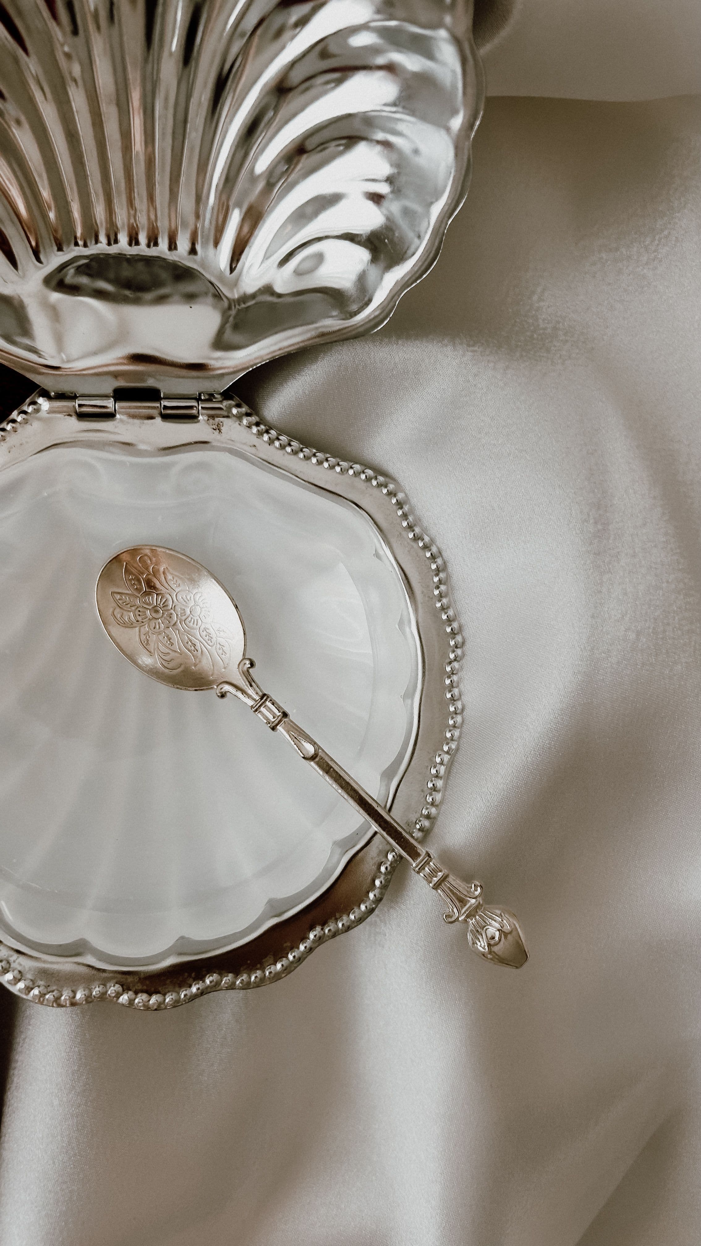 Coffee and a simple breakfast laid out with everyday silver and ceramics