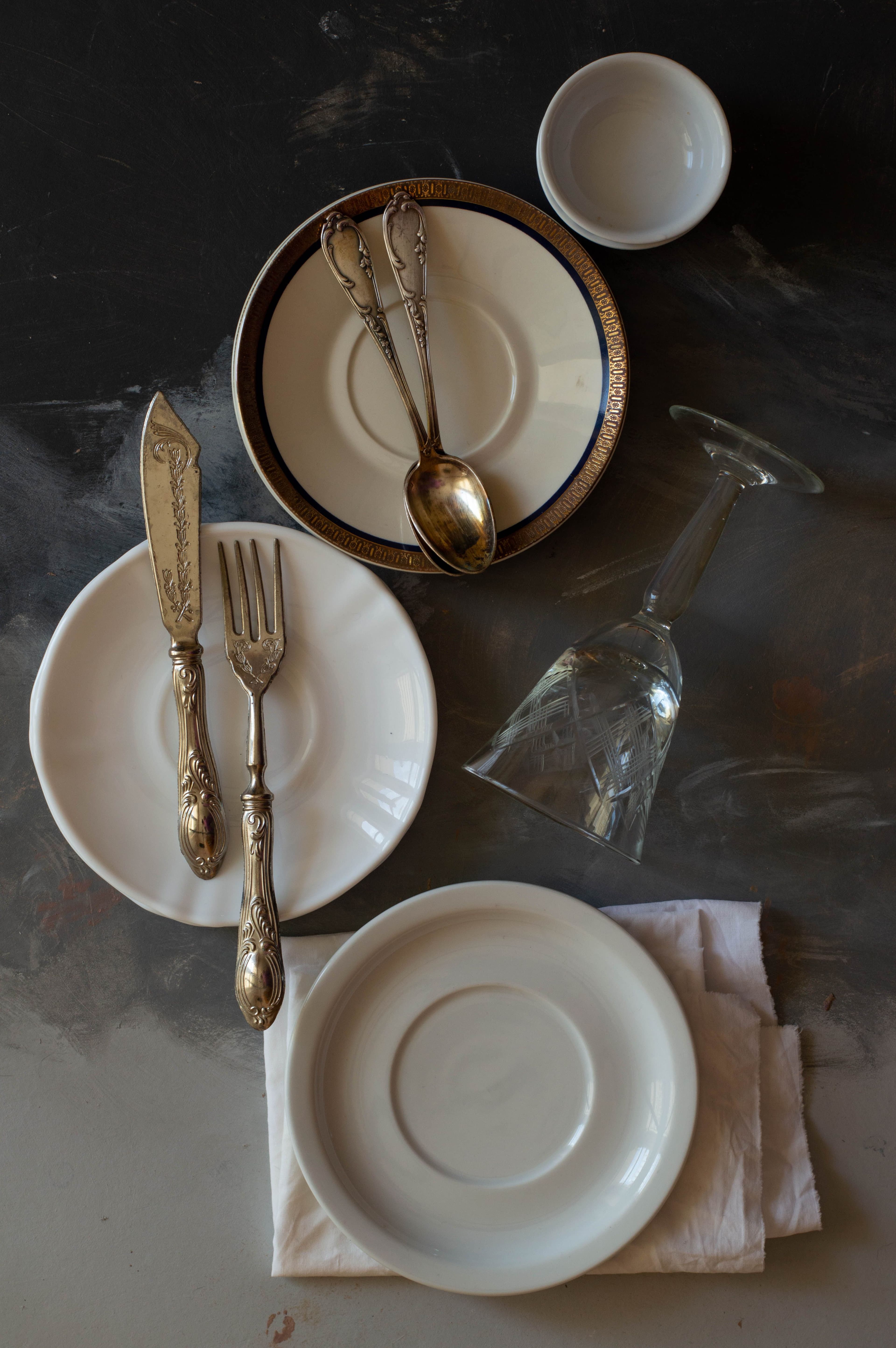 An ordinary table set with silver, glass and linen for an everyday meal